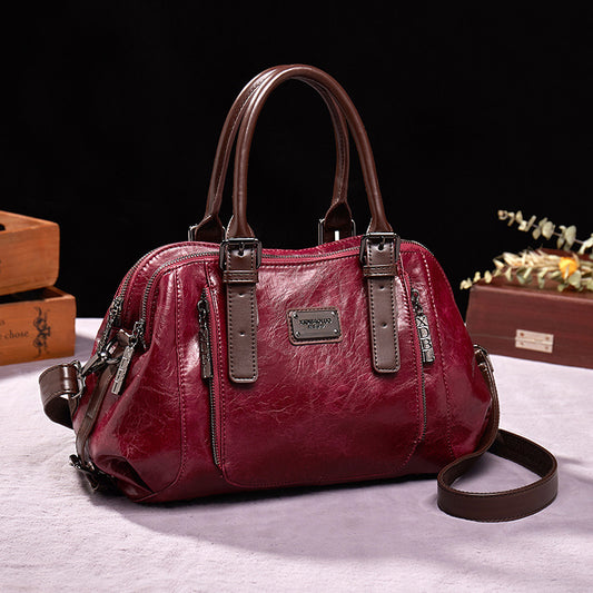 Sac à main en cuir véritable rouge pour femme, design élégant, porté main, épaule ou bandoulière, style tote polyvalent.